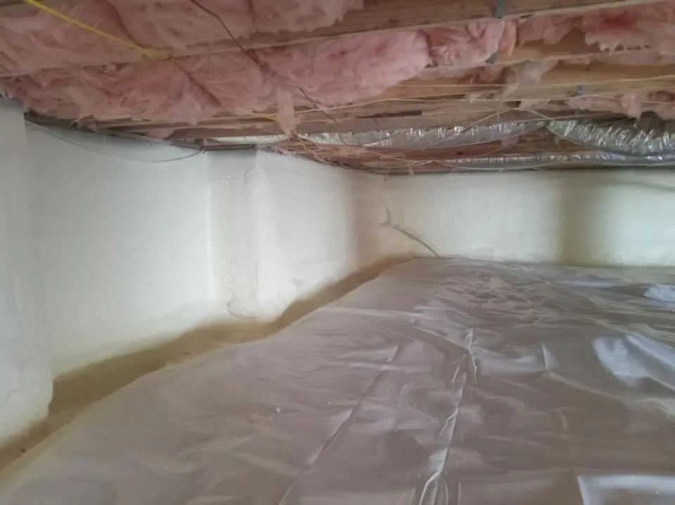 Crawl space encapsulation with closed-cell spray foam for Commercial Roof Restoration in Springfield